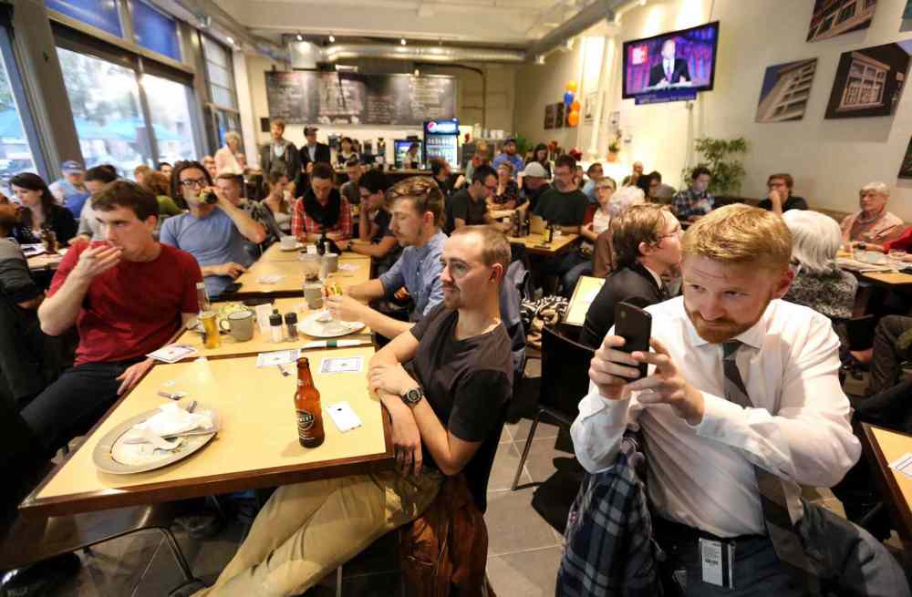Crowd watching the leaders debate at the Free Press News Cafe, Thursday, September 17, 2015. (TREVOR HAGAN / WINNIPEG FREE PRESS)